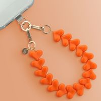 Selencia Cover trasparente con ganci + laccetto da polso Lova Apple iPhone 16 - Arancio
